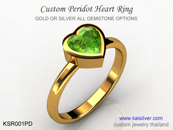 sllim gold ring with heart gemstone